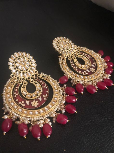 Very stylish and classy! Match your trendy outfits with modern bling and up to date gorgeous piece of jewels! We got you cover! These beautiful in fashion big size double kundan chandbali embellished with hand painted meena work earrings are in stock and ready to ship. Color : pink , red sold, Earrings Chandbali, Kundan Chandbali, Hyderabadi Jewelry, Work Earrings, Pakistani Earrings, Earrings Kundan, Hand Cuffs, Braid Accessories, Bali Earrings