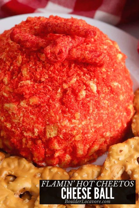 This spicy cheese ball recipe is a perfect party appetizer. It's one of those yummy appetizers that's perfect for holiday parties, Halloween parties, and whenever you need easy appetizer recipes. A classic cream cheese ball bursting with spicy flavor from delicious ingredients and a Flamin' Hot Cheetos coating! Pink Cheese Ball, Birria Cheese Balls, Valentine Cheese Ball, Hot Cheeto Cheese Ball, Chicken Cheeto Balls, Cream Cheese Dessert Ball, Hot Cheetos Jambalaya Balls, Flamin Hot Cheetos Recipe, Hot Cheetos Boudin Balls