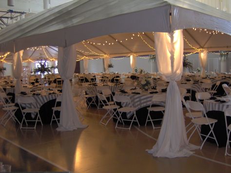 Tents can be set up inside to define a space--such as this wedding reception held inside a church gymnasium. Diy Chandelier Wedding Receptions, Wedding In A Gymnasium, Gymnasium Decorations, Gymnasium Wedding Reception, Church Wedding Reception Decorations, Gym Wedding Reception Decoration, Church Gym Wedding Reception, Church Reception Decorations, Oxblood Wedding