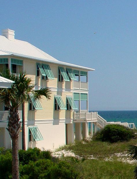 Yellow Beach House Exterior, Beach House Exterior Seaside, Bahama Shutters Exterior, Turquoise Shutters, Yellow Beach House, Ocean Views Beach, Beach House Colors, Bahama Shutters, California Beach House