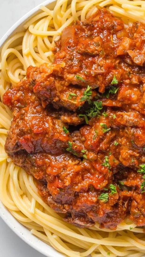 Short rib bolognese is an amazing one-pot meal, slowly braised and tender bites of beef short rib in a classic, flavor packed slow cooker bolognese sauce anyone can make. An easy short rib pasta sauce made with braised beef short rib, it's a comfort food that's perfect for family dinner recipes and easy meals. Short Rib Spaghetti Sauce, Short Rib Bolognese Sauce, Short Rib Pasta Sauce, Short Rib Bolognese, Short Rib Pasta, Short Rib Beef Stew, Short Rib Stew, Slow Cooker Bolognese Sauce, Slow Cooker Bolognese