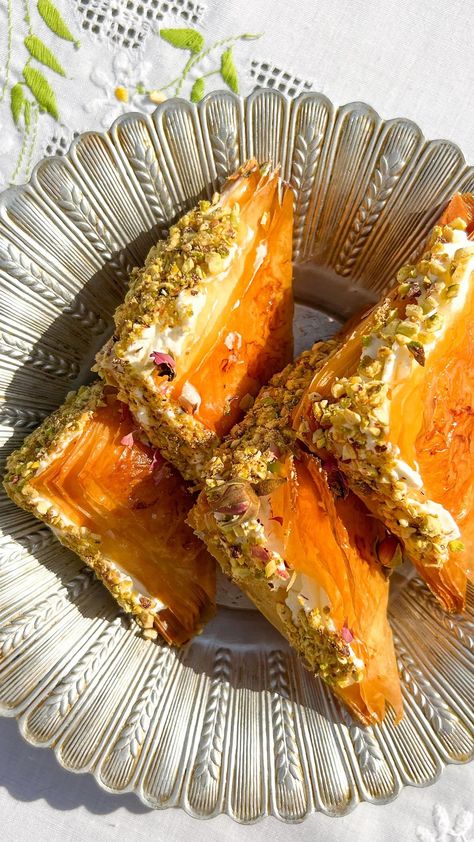 Radina Dickson 🎗 | Warbat- baklava triangles with cream and pistachios. Recipe: One packet of filo sheets 4 tbsp melted butter 1.5 cups simple syrup (made… | Instagram Filo Pastry Recipes Sweet, Baklava Plating, Rolled Baklava Recipe, Baklava Filling, Baklava Cookies, Syrian Dessert, Easy Baklava Recipe Phyllo Dough, Baklava Inspired Desserts, Pistachio Baklava Rolls