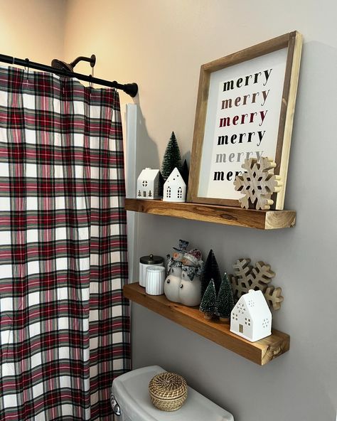 Sharing some still photos this morning! A while back Lance and I did that beadboard wall, the floating shelves and a few other little updates in this guest bathroom. It was so fun to dress it up for Christmas with the new makeover! Obsessed with that plaid @potterybarn shower curtain! “The Christmas Bell” and “merry” signs come in so many different sizes! I would love to make you some Christmas/Winter wall art! Have a happy day friends 🥰 . . . . #christmasbathroom #christmasmagic #christmasis... Christmas Bathroom Decor Farmhouse, Bathroom Decor Ideas For Christmas, Green Christmas Bathroom Decor, Christmas Half Bath Decor, Christmas Toilet Decoration, Christmas Bathroom Shelf Decor, Christmas Bathroom Decor Ideas Simple, Christmas Decor Bathroom Ideas, Restroom Christmas Decor