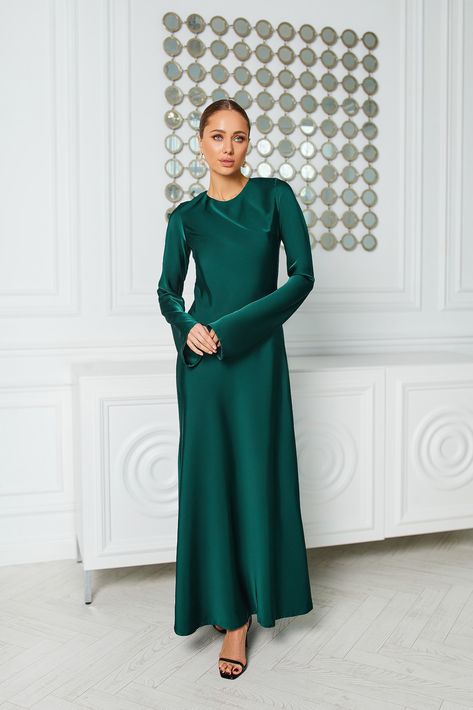 Dress to impress in our Opulent Emerald Satin Maxi Dress. Featuring long sleeves and a luxurious satin fabric, this dress exudes opulence and sophistication. The emerald green hue adds a touch of drama, while the maxi length creates a stunning silhouette. Perfect for red-carpet events or upscale parties, this dress ensures you stand out with poise and elegance.   #dress #dresses #maxidress #emeralddress #satindress #longsleeve #eveningdress #weddingdress Emerald Green Long Sleeve Dress, Green Lace Maxi Dress, Long Sleeve Satin Dress, Green Wedding Dresses, Court Wedding, Emerald Dresses, Satin Long Sleeve, Maxi Dress Sale, Satin Maxi