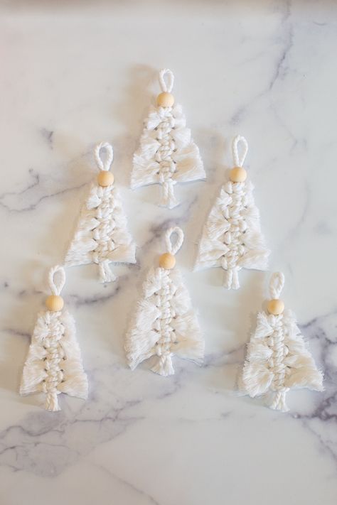 These woven Christmas trees make lovely decor, present toppers, or gifts. Click to learn how to make macrame Christmas ornaments. They're easy to make and look beautiful as holiday decor. Small Macrame Christmas Tree, Easy Macrame Christmas Decorations, Christmas Macrame Decorations, Easy Christmas Macrame Ideas, Easy Macrame Christmas Ornaments, Easy Macrame Ornaments, Easy Macrame Christmas Tree, Makramee Christmas, Christmas Macrame Ideas