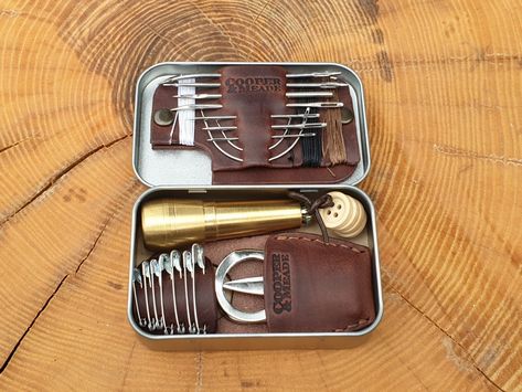 A bushcraft essential neatly stored in a handy, compact tin and carried in a custom made leather pouch. Bushcraft Essentials, Leather Goods Handmade, Leather Artisan, Sewing Kit, Leather Pouch, Bushcraft, Leather Goods, Custom Made, Tin