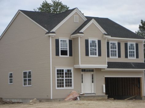 A creamy off-white or tan on the siding with navy shutters and front door would be spectacular. Description from houzz.com. I searched for this on bing.com/images Tan Siding, Navy Shutters, Certainteed Vinyl Siding, Vinyl Siding Colors, Exterior Siding Colors, Tan House, Grey Siding, Shutter Colors, Black Roof