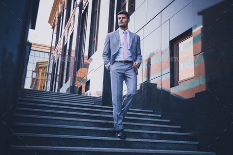 Businessman walking on the stairs outdoors by vadymvdrobot. Full length portrait of a handsome thoughtful businessman walking on the stairs outdoors#outdoors, #vadymvdrobot, #stairs, #Businessman Business Man Photography, Rooftop Photoshoot, Business Portrait Photography, Corporate Portrait, Business Photoshoot, Men Photoshoot, Man Photography, Corporate Headshots, Professional Portrait