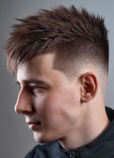 This starts with a low fade right above the ear, and then a shock of rather long hair is on top. To style the hair, apply a bit of mousse and tease the hair up, keeping it a bit messy. Low Fade Hairstyle, Blowout Hairstyle, V Shaped Haircut, Fade Hairstyle, High Fade Haircut, Medium Fade, Low Fade Haircut, Popular Mens Hairstyles, Tapered Hair