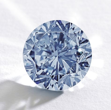 A 7.59-carat round fancy vivid blue diamond is being offered as the top lot in Sotheby’s Hong Kong Magnificent Jewels and Jadeite sale scheduled for October 7 2013 at the Hong Kong Convention and Exhibition Centre.  Known as the Premier Blue, this brilliant-cut internally flawless gem is the largest round fancy vivid blue diamond ever graded by the Gemological Institute of America, Sotheby’s said. The auction house expects the stone to fetch about $19 million. Hope Diamond, Flawless Diamond, Gem Diamonds, Rare Gems, Diamond Star, Rocks And Gems, Precious Gems, Gems And Minerals, Pink Diamond