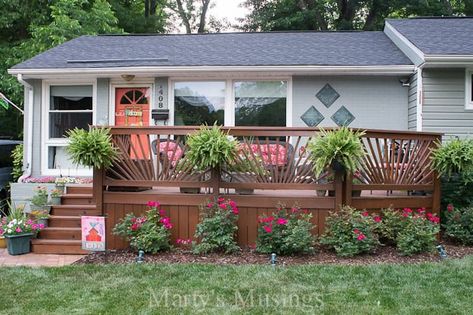 See how these DIY homeowners planned and converted their 1950's ranch style house into an updated home with terrific curb appeal and a fabulous front deck. House With Front Deck, Front Patio Makeover, Tree House Deck, Front Porch Pictures, Deck Restoration, Flowers Gardening, Deck Projects, Front Deck, Cool Deck