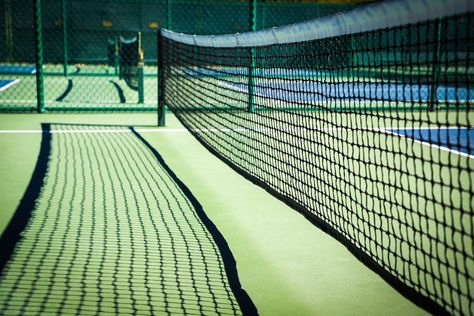 Although pickleball has been in existence for many years, it has just recently grown in popularity here in Auburn. The initial questions about pickleball that arise in everyone’s minds are, “What is it?,” “Do I play with a pickle?,” and “Is it like whiffle ball?” Well no, it is not like whiffle ball, but the ball is similar, and there are no pickles involved. The History of PickleballPickleball was invented in 1965 on Bainbridge Island, a short ferry ride from Seattle, Washington. Three dads – J Pickleball Court Size, Whiffle Ball, Tennis Nets, Tennis Net, Wiffle Ball, Badminton Court, Pickleball Court, Gym Flooring, Pickleball Paddles