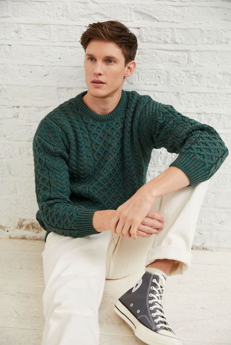 A symbol of Ireland past and present, the Inisheer Traditional Aran Sweater is a timeless addition to your wardrobe. Made with 100% Merino wool, the quality of this authentic Irish gem cannot be rivalled. It is a true Irish hero Aran piece.   Much like its namesake, the Inisheer Aran Sweater captures the essence of Ireland in all of its glory. With a beautiful combination of traditional Aran stitches such as honeycomb, moss and cable, this piece is inspired by the past while remaining firmly roo Irish Outfit Men, Forest Green Outfit Men, Christmas Outfits Aesthetic Men, Mens Fashion Pastel, Soft Natural Men Kibbe Style, Green Men Aesthetic, Jewel Tone Outfits Men, Green Cable Knit Sweater Outfit, Green Aesthetic Outfit Men