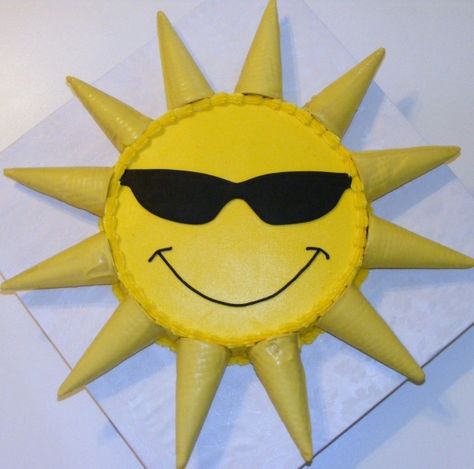 Sunshine cake-- (without the sunglasses) the ice cream cones are dipped in chocolate melts.. Sun Shine Cake, Sun Cake And Cupcakes, Ray Of Sunshine Cake, Fun In The Sun Cake, Sunglasses Cupcakes, Sunshine Cakes, Splish Splash Birthday Party, Sunshine Birthday Cakes, Thomas Birthday Cakes