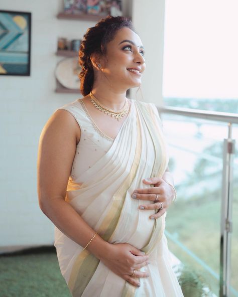 Pearle Maaney, who is a famous actor and a YouTuber, announced her second pregnancy last week. The gorgeousness is married to Srinish Aravind with whom she fell in love on the reality show, Bigg Boss Malayalam. Recently, Pearle shared glimpses of her godh bharai ceremony. And it was her four-year-old daughter, Nila, who won hearts as she twinned with her pregnant mommy.    Pearle Maaney's godh bharai pictures    On July 17, 2023, Pearle took to her Instagram handle and posted ... Pearle Maaney, Pregnant Mommy, Two Ponytails, Second Pregnancy, Bigg Boss, Social Media Stars, Instagram Handle, Stunning Wallpapers, July 17