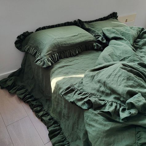 Transform your bedroom into a tranquil oasis with our Jungle Green Linen Duvet Cover Set adorned with exquisite handmade ruffles. Crafted from luxurious European linen made from long fiber yarns, this set of three includes one duvet cover and two matching pillowcases, elevating your sleep space with both style and comfort. ~ Jungle Green Elegance: Immerse yourself in the calming allure of jungle green, bringing a touch of nature into your bedroom. The soothing color palette is perfect for creati Jade Green Bedding, Green Ruffle Bedding, Green Bedsheet Bedroom, Black And Green Bedding, Green And Brown Bedding, Bedcover Aesthetic, Green Quilt Bedding, Green Bedding Aesthetic, Green Bedsheets