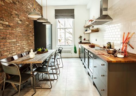 Long, narrow dining table for a galley kitchen. It can be pushed against wall when not in use & even better with bench seating on the wall side. Industrial Interior Kitchen, Narrow Dining Tables, Long Narrow Kitchen, Modern Industrial Kitchen, Industri Modern, Industrial Kitchen Design, Loft Kitchen, Galley Kitchens, Industrial Style Kitchen