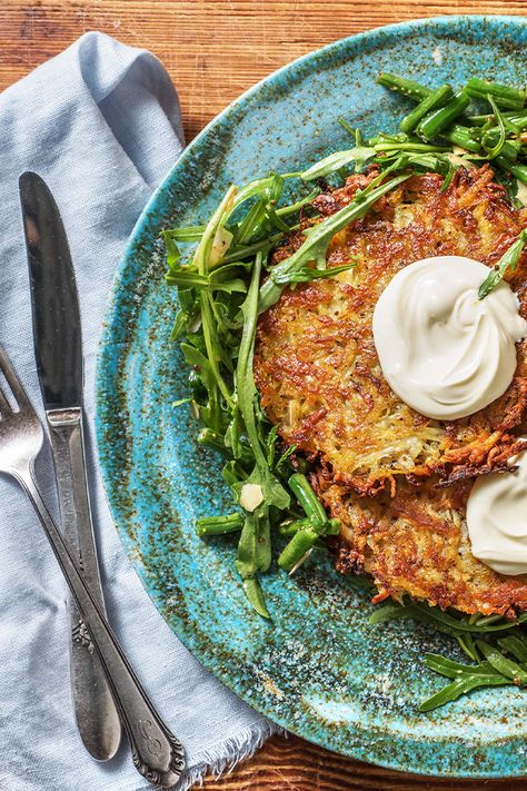 This is not your average potato rosti recipe. We have jazzed up the classic pan-fried potato cake, with cheesy, salty and chewy halloumi! Simple but impressive, dinner tonight is a winner! Halloumi Potato Scarpaccia, Potato Rosti Recipe, Fried Potato Cakes, Sweet Potato Rosti, Rosti Recipe, Potato Rosti, Fried Halloumi, Impressive Dinner, Fried Potato