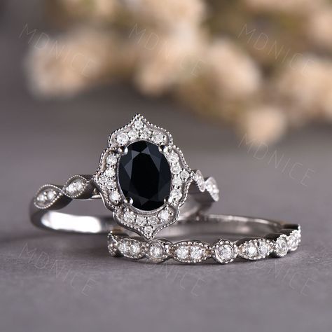 Oval cut Black Onyx engagement ring set vintage Moissanite sterling silver ring art deco half eternity stacking matching band Bridal gift Unique wedding set,perfect as engagement/wedding ring, birthday or anniversary gift, etc. Engagement Ring ❀gemstone is 5x7mm oval cut natural black onyx❀ ❀Side stone and halo stone: Moissanite stones,VVS Clarity,AAA❀ ❀925 Sterling Silver,Rose/White/Yellow Gold Plated❀ ❀14/18k Solid White/Rose/Yellow gold❀ Wedding Band ❀Round cut Moissanite stones, VVS Clarity, Engagement Rings Silver Black, Black Silver Engagement Ring, Vintage Black Ring, Onyx Engagement Ring Silver, Black Stone Engagement Ring, Fantasy Wedding Rings, Black Stone Ring Engagement, Unique Wedding Sets, Gothic Wedding Rings