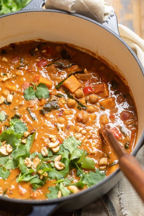 close up of vegan west african peanut stew in a large pot. Peanut Stew Vegan, West African Peanut Stew, West African Peanut Soup, African Peanut Soup, African Stew, Stew Vegan, African Peanut Stew, Peanut Stew, Peanut Soup