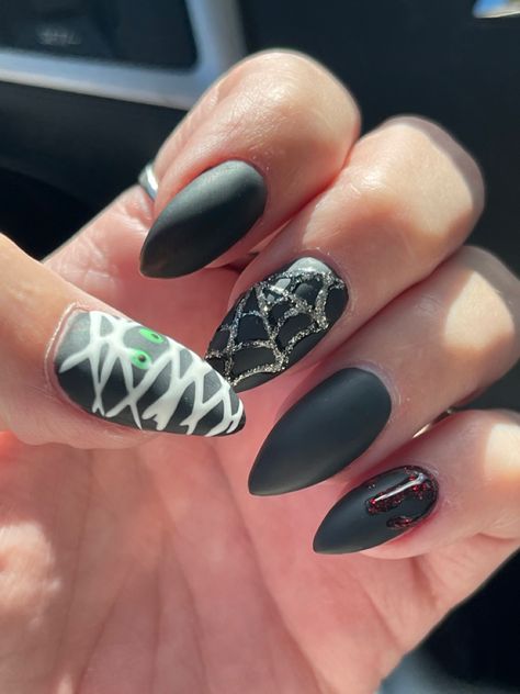 Black mat, Halloween nails with sparkly spiderwebs, sparkly blood drip and mummy Mummy Acrylic Nails, Mummy Nail Designs, Purple Mummy Nails, Cute Halloween Nails Mummy, Black Halloween Nails Mummy, Mummy Nails, Blood Drip, Holiday Nails, Halloween Nails