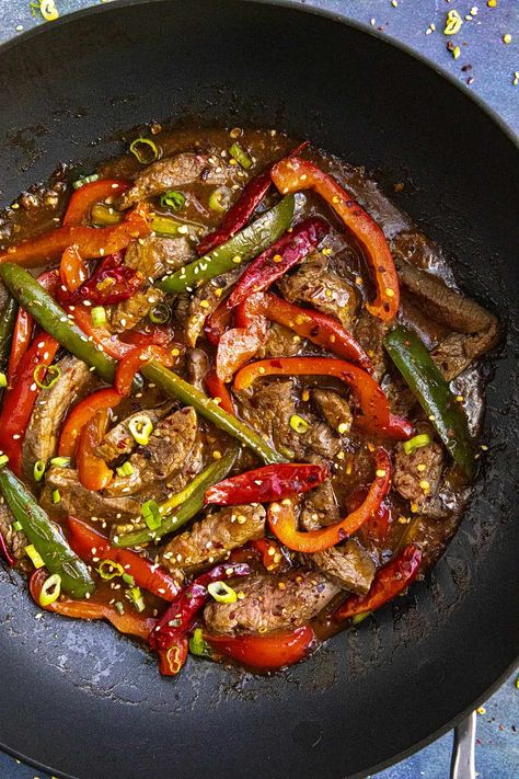 Szechuan Beef Recipe - This Szechuan beef recipe is perfect for spicy food lovers with tender cuts of beef and sliced peppers stir fried in a bold sauce with fiery Szechuan flavors. Szechuan Beef Recipe, Asian Stir Fry Recipe, Szechuan Beef, Beef Broccoli Stir Fry, Air Fryer Recipes Appetizers, Cuts Of Beef, Healthy Potatoes, Zesty Sauce, Shredded Chicken Recipes