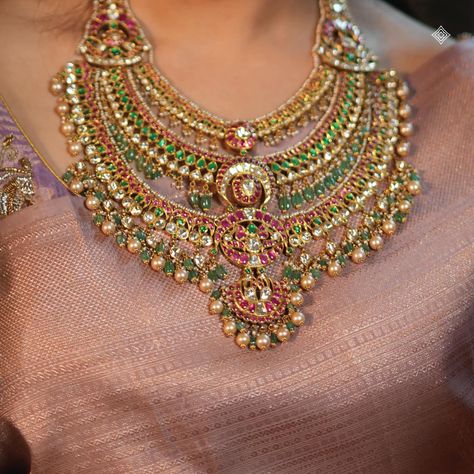 Let our breathtaking 22k multilayer heritage necklace be the sparkle that completes your celebration. Adorned with exquisite rubies, emeralds, valanda, and cultured pearls, this South Indian masterpiece elevates every moment. Embrace tradition and make memories that shine as bright as the festive lights. WhatsApp 9964641869 for enquiries. 📍Visit the Blue CKC&Co. Flagship store, near Safina Plaza. Look for the DIAMOND logo! #HeritageJewellery #IndianJewellery #FestiveSeason #Diwali #Festiv... Ruby Haram Designs Gold Latest, Ruby Jewelry Necklaces Indian, Kundan Haram, Emerald Design, Vintage Indian Jewelry, Ruby Jewelry Necklaces, Pearls Jewellery, South Indian Bridal Jewellery, Wedding Jewellery Designs