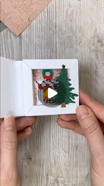 Katharina Tarta on Instagram: "Another shadow box idea, this time with a Christmas theme 😊 And the best thing: You can built up any scene you want in there 😊 A snowy landscape, a pile of gifts, carol singer? What ever you like and gets you in a Christmas mood 😉 Anyway, hope you like this little paper Christmas idea 😊 Ad: The beautiful design paper is from @raindroplila The one I used here just reminded me of a tapestry in a super cosy family home at Christmas, so I just had to use it this way 😊 #christmascrafts #christmascard #papercrafts" Paper Shadow Box Art, Christmas Shadow Box Ideas, Cosy Family Home, Shadow Box Christmas, Children Crafts, Christmas Shadow Boxes, Christmas Craft Fair, Matchbox Art, Christmas Idea