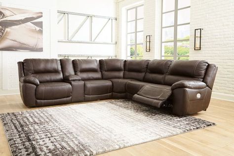 Load up on comfort in a cool, clean-lined and contemporary way with this power reclining sectional. You'll enjoy the feel of leather everywhere your body touches. It features a one-touch power control with adjustable positions and includes an Easy View™ adjustable headrest that allows a primo view of the TV even when you're reclined. Extended ottomans provide extra length for leg comfort. A USB plug-in at your fingertips lets you charge up as you chill out. Grain Effect, Power Reclining Loveseat, Power Reclining Sofa, Living Room Collections, Modular Sectional, Reclining Sectional, Power Recliners, Ashley Furniture, Reclining Sofa