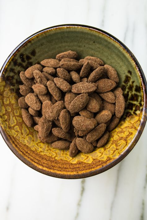 cocoa roasted almonds  | toot sweet Cocoa Roasted Almonds, Cocoa Dusted Almonds, Roasted Almonds Recipe, Homemade Cocoa, Cleaning Baking Sheets, Roasted Almond, Travel Snacks, Chocolate Company, Sweet Bakery