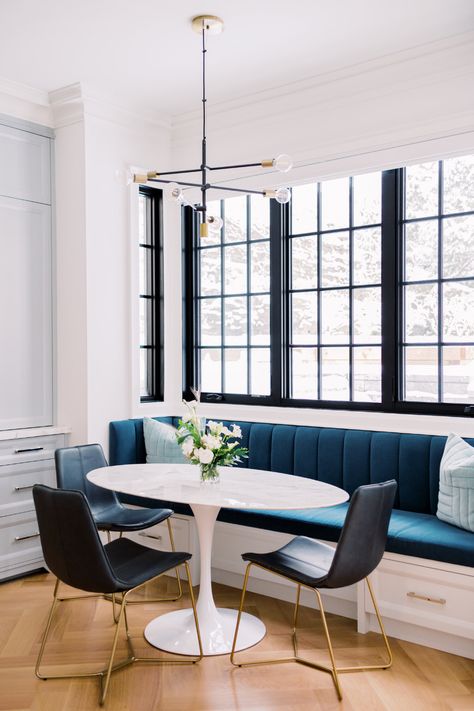 Gorgeous Parisian inspired breakfast nook with a built-in banquette in blue velvet with a view. Interior design by Harrison Fae Design and interior photography by Heidi Lau Photography. Built In Banquette Kitchen Modern, Breakfast Nook Sunroom Ideas, Banquette Breakfast Nook, Parisian Breakfast Nook, Banquette In Front Of Window, Velvet Breakfast Nook, Basement Banquette, Blue Banquette Seating, Banquet Seating Dining Room