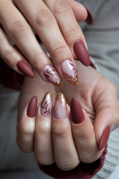 Embrace the beauty of autumn with these stunning fall nail ideas that feature delicate maple leaves dusted with shimmering glitter. The warm hues of red, orange, and gold mimic the vibrant foliage outside, while the glitter adds a magical touch that makes your nails truly pop. Perfect for cozy gatherings or a day out, these nails are sure to turn heads! Try this look and let your nails celebrate the season! Red Wine And Gold Nails, Autumnal Nails 2024, Diwali Inspired Nails, Maple Leaves Nails, Red Fall Nails Ideas, Simple November Nails, Fall Acrylic Nails Almond, Christmas Wedding Nails, Autumn Leaves Nails