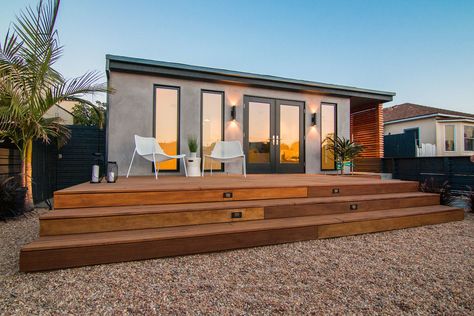 Dwell - Merging Inside and Out, an L.A. Firm Modernizes a 1940s Abode Mahogany Deck, Smooth Stucco, 1940s Bungalow, Decomposed Granite Patio, Raised Planters, Deck Wood, Mahogany Decking, Aluminum Windows, Wood Fences