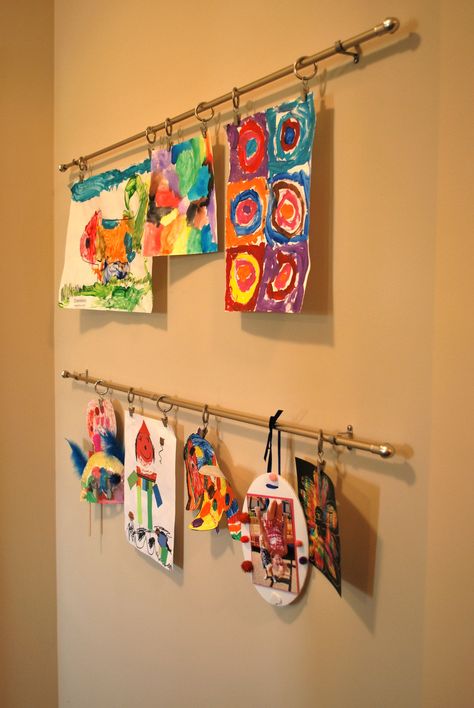 Art display using simple cafe rods with clip rings Hanging Art In Front Of Window, Art Rail Display, Kids Art Gallery Wall, Playroom Basement, Cafe Rod, Art Bulletin Boards, Simple Cafe, Displaying Kids Artwork, Kids Art Galleries