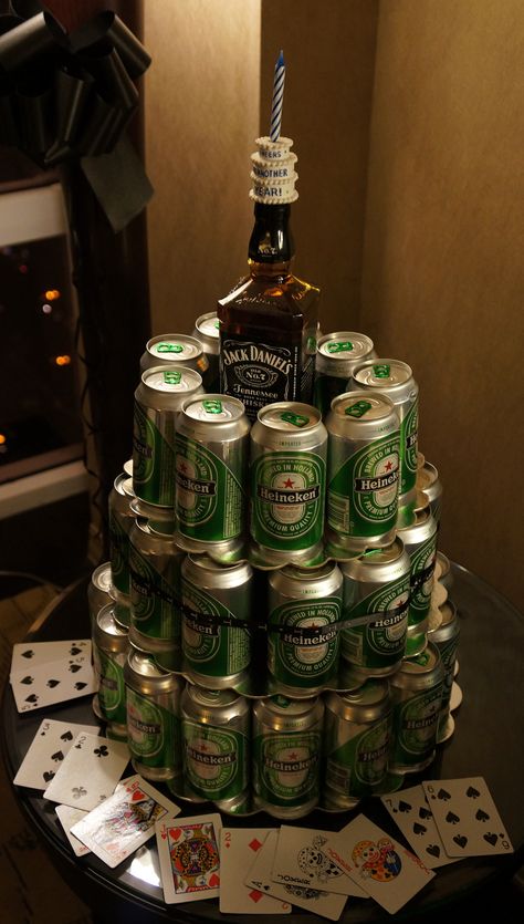 Tiered Heineken Beer Cake. For my honey and his groomsmen. Our jack Daniel bottle will have our picture on it Surprise Boyfriend Ideas, Heineken Beer Cake, Beer Cake Tower Diy, Beer Cake Tower For Men, Beer Tier Cake, Heineken Cake, Cake With Jack Daniels Bottles, Beer Can Cake Tower, Funny Grooms Cake