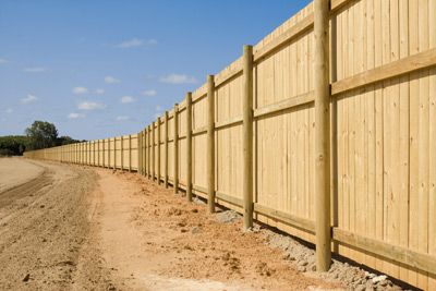 Rural Privacy fence with treated round post and three horizontal rails.  #fence Stockade Fence, Wood Fence Post, Aluminum Fencing, Fencing Material, Types Of Fences, Fencing Companies, Privacy Fences, Deck Builders, Bamboo Fence