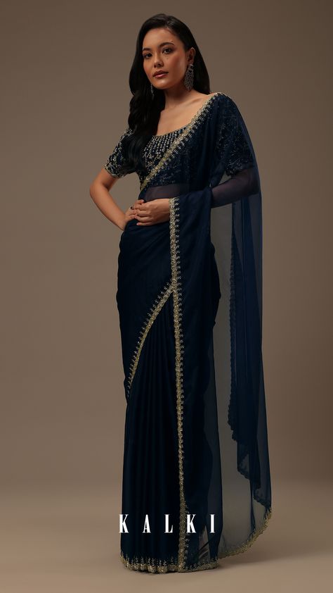 "Introducing our enchanting dark blue plain organza saree, a celebration of simplicity and opulent detailing. This saree showcases a cutdana border that adds a touch of elegance. The unstitched blouse fabric features heavy cutdana work all over. EVENT - Perfect for evening parties. The saree comes with a matching unstitched blouse." Dark Blue Saree Party Wear, Dark Blue Saree Blouse Combination, Saree Detailing, Malayalam Saree, Dark Saree, Peacock Blue Saree, Dark Blue Saree, Plain Saree With Heavy Blouse, Dark Blue Plain