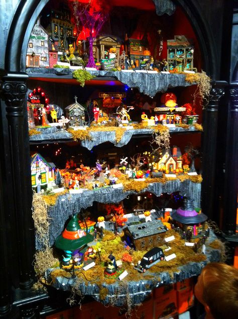 Halloween Village Display / Department 56 Halloween Village / = Great display idea for bookcases! Halloween Village Display Shelf, Lemax Halloween Village Display, Spookytown Display Ideas, Dept 56 Halloween Village Display, Department 56 Halloween Village Display, Disney Halloween Village Display, Lemax Spooky Town Display Ideas, Halloween Town Display, Halloween Village Display Ideas