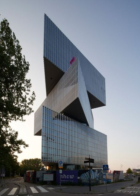 OMA's nhow amsterdam RAI hotel documented by nils koenning Triangle Building Architecture, Stacked Architecture, Prison Architecture, Crazy Architecture, Triangle Building, Narrow House Designs, House Architecture Styles, Hotel Amsterdam, Deconstructivism