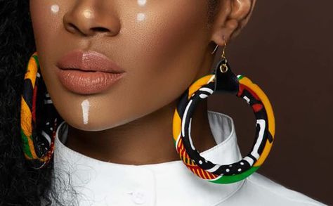 Measurements: Length- approximately 4in. Width- approximately 3in. Color: Multi-color, prominent- yellow, green, black and red Afrocentric Earrings, Africa Earrings, Kente Print, African Accessories, African Earrings, Fabric Earrings, African Wax Print, African Jewelry, Fabric Jewelry