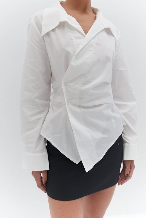 Welcome the Freya Shirt - White - a classic white shirt with a twist. This shirt features a chic button detail at the waist and an asymmetrical front cut Designer White Shirt For Women, Structured Shirts For Women, Fits With White Shirt, Asymmetrical Button Down Shirt, Shirt Runway, Twist Shirt, Asymmetric Shirt, Asymmetrical Shirt, Trendy Fashion Accessories