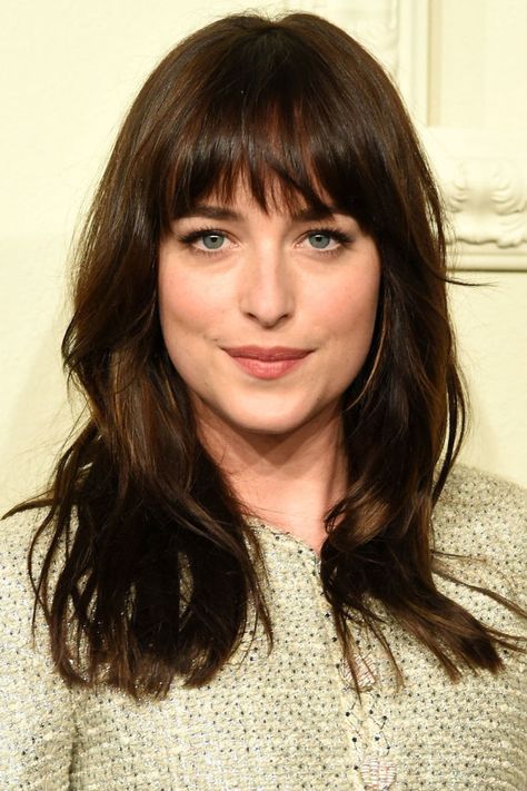 A classic, full fringe with a choppy finish looks great on Dakota Johnson. Getty Images   - HarpersBAZAAR.co.uk Full Fringe Hairstyles, Dakota Johnson Hair, Bangs With Medium Hair, Hair 2018, Mtv Movie Awards, Fringe Hairstyles, Long Brown Hair, Hair With Bangs, Long Hair With Bangs