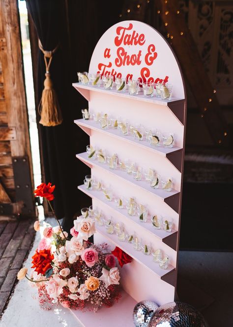 Tequila shot favours and table plan in one decoration idea Shots Table Party Ideas, Tequila Wall Wedding, Shot Table Party Ideas, Welcome Drinks Table Ideas, Shot Seating Chart Wedding, Party Seating Chart, Preston Court Wedding, Shot Board, Elopement Celebration