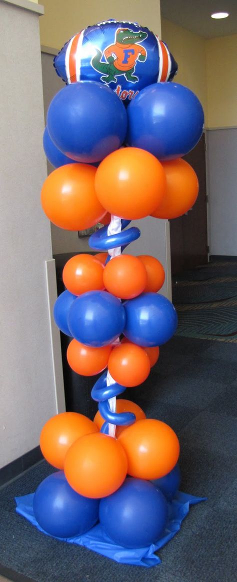 Gator balloon topiary Florida Gators Party Ideas, Uf Themed Party, Gator Graduation Party, Uf Graduation Party Ideas, Gator Party, Balloon Topiary, Uf Gator, Balloon Inspiration, Column Ideas