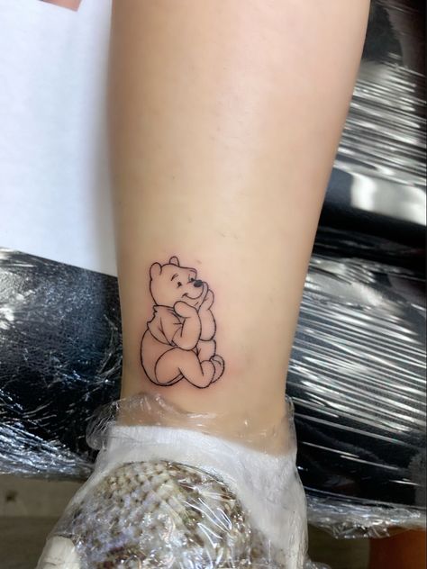 Tattoo Ideas Female Winnie The Pooh, Women Disney Tattoos, Whitney The Pooh Tattoo, Cute Winnie The Pooh Tattoos, Whinney Pooh Tattoo, Fine Line Winnie The Pooh Tattoo, Pooh Bear Tattoos, Winnie The Pooh Tattoo Quotes, Small Winnie The Pooh Tattoo