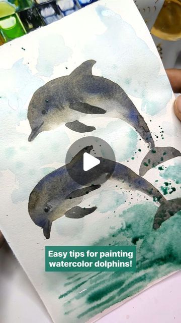 Irshad Ahmad Ansari on Instagram: "Ready to dive into a fun and creative watercolor technique?  In my latest reel, I'll show you how to paint adorable dolphins using just your palm and some simple color blending. This technique is perfect for artists of all levels.  Follow along as I guide you step-by-step, from creating the initial stamp to adding realistic details and finishing with a stunning background.   Don’t miss out—save this tutorial, try it out, and share your results! Let’s keep spreading the joy of watercolor together. 🌊🎨  #WatercolorDolphins #ArtTutorial #CreativeTechniques #Watercolor #ArtForEveryone #artreels" Painting A Dolphin, Watercolor Sea Animals Tutorial, Dolphin Watercolor Painting, Dolphin Watercolor Painting Easy, Dolphin Oil Painting, Step By Step Watercolor, Simple Colors, Color Blending, Watercolor Techniques