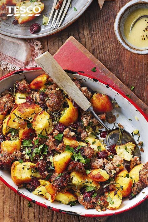 If you can resist eating them all on Christmas or Sunday , turn leftover roasties into this potato and stuffing hash. With crispy stuffing, fragrant herbs and juicy cranberries, this makes the ultimate festive bake. Quick budget family meal recipe ideas for Monday , serve up with leftover roast meats  | Tesco Christmas Food Recipes Appetizers, Christmas Savoury Baking, Christmas Meal For 2, Christmas Food Ideas Savoury, Christmas Food Vegetarian, Festive Dinner Ideas, Savoury Christmas Food, Christmas Savoury Food, Christmas Recipes Savory