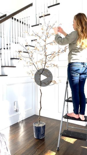 692K views · 9.5K reactions | Two out of my three DIY trees survived our move last fall! 
And while I was sad to learn that my massive faux olive tree (which was over 8 feet tall!) didn’t make it, I was so thankful that both of my DIY Fall Maple Trees made it to our temporary home.
They just have to make one more move to our new home once it’s finished being built later this year! 
When I started planning this DIY I wanted to create a super big fall tree and swap out the olive tree for the new fall tree in our entryway.
But once I had gathered all of the maple stems (from two different stores) I decided to make two fall trees to place on our front porch.
And I love how they turned out!
What’s your favorite fall tree? | Domestically Blissful | Iron & Wine · Autumn Town Leaves Autumn Town, Diy Trees, Domestically Blissful, Autumn Porch, Fall Ball, Faux Olive Tree, Fall Trees, Maple Trees, Fall Tree