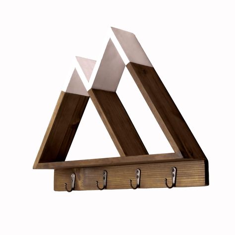 PRICES MAY VARY. Multi-Function. Our modern Twin Peak floating mountain shelf is not just great to look at but is also a fantastic high quality wall organizer allowing you to store letters, sunglasses and wallets. Showcase plants and crystals or use as an essential oil shelf in the bathroom. With the added benefit of 4 hooks you’ll be able to organize Keys, hats, necklaces, jewelry, medals and ribbons - making sure you’ll know where they’re kept everytime. Unique Design. Not only a fantastic org Entryway Floating Shelves, Mountain Nursery Wall, Mountain Shelf, Adventure Theme Nursery, Essential Oil Shelf, Mountain Nursery, Locker Decorations, Triangle Shelf, Adventure Nursery