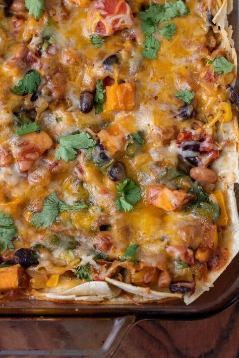 Healthy vegetarian enchilada casserole with sweet potato, zucchini, flour tortillas and an easy homemade enchilada sauce! Vegan version can be found in recipe notes.Taco Tuesday and meatless Monday just got a whole lot better…This vegetarian enchilada casserole is loaded with so much flavor you won’t even miss the meat!Made with veggies like spinach, sweet potatoes and zucchini with the classics like corn, beans and cilantro, it’s a warm and comforting dish the family will love and you… Zucchini Flour, Veggie Enchilada Casserole, Frozen Enchiladas, Vegan Enchilada Casserole, Sweet Potato Zucchini, Vegetarian Enchilada, Vegetarian Enchilada Casserole, Homemade Enchilada Sauce Recipe, Potato Zucchini